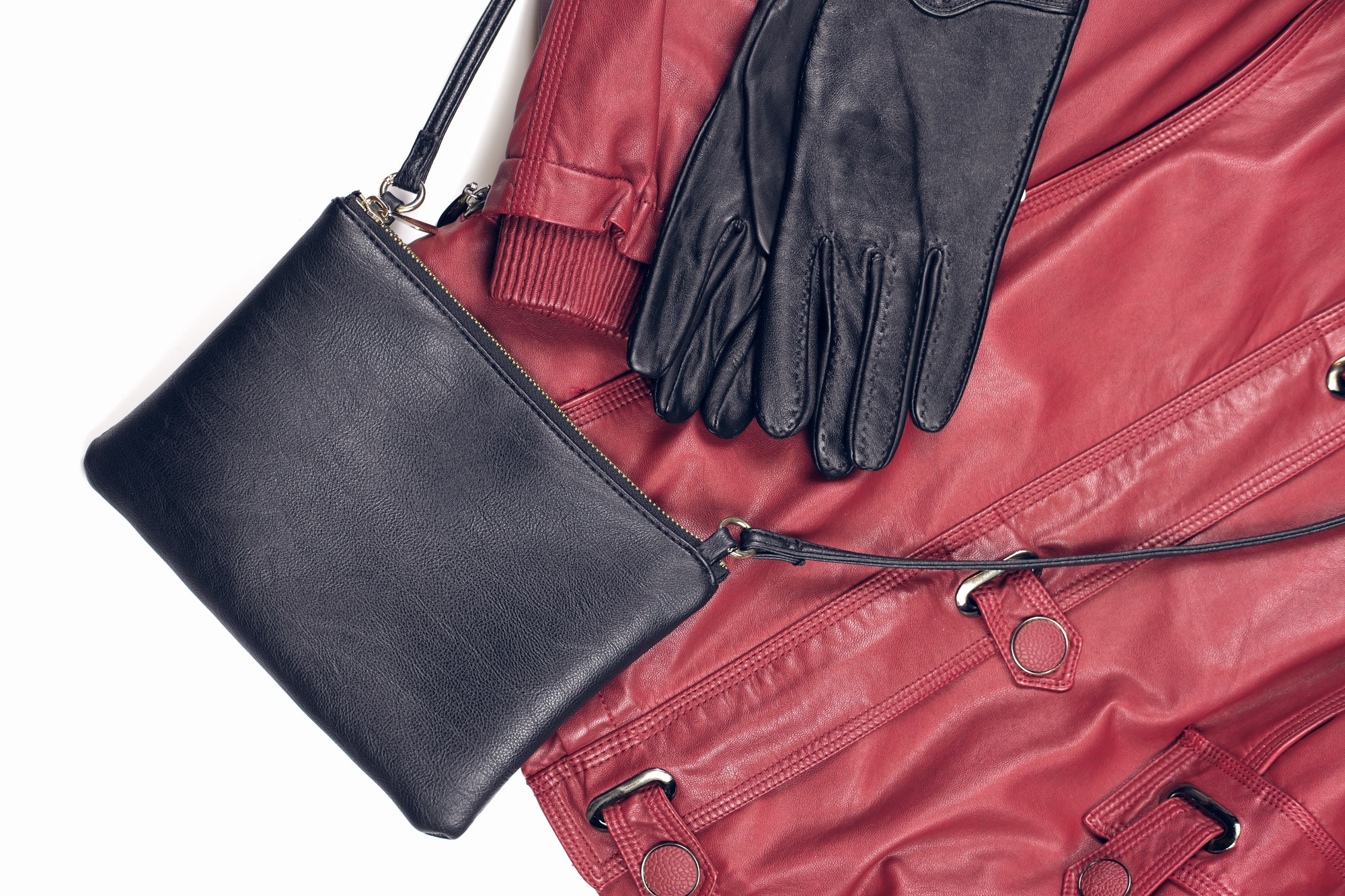 winter female outfit idea. red fake leather jacket and gloves